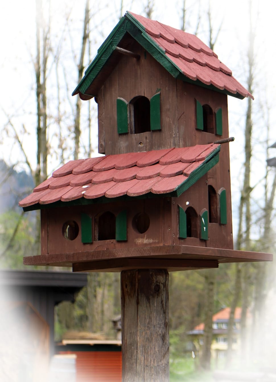 brown and green wooden bird house preview