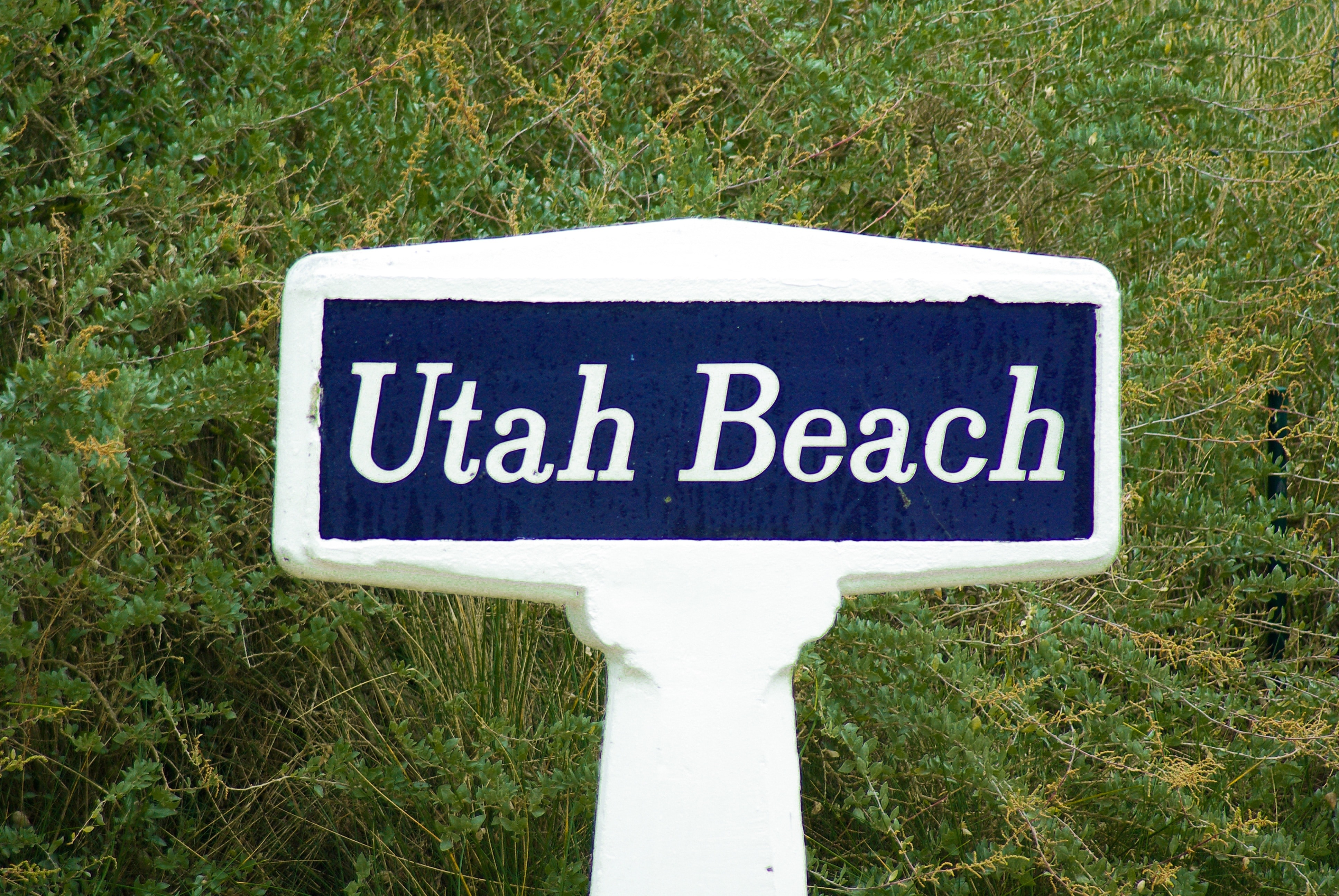 white and blue utah beach signage