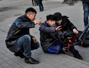 photography of group of people shooting scene thumbnail