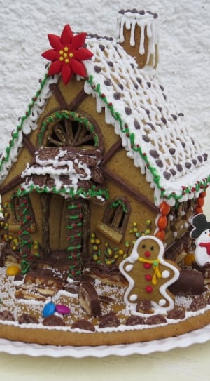 brown, green, and white candy house ceramic figurine thumbnail