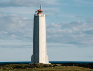 lighthouse photo during daytime thumbnail