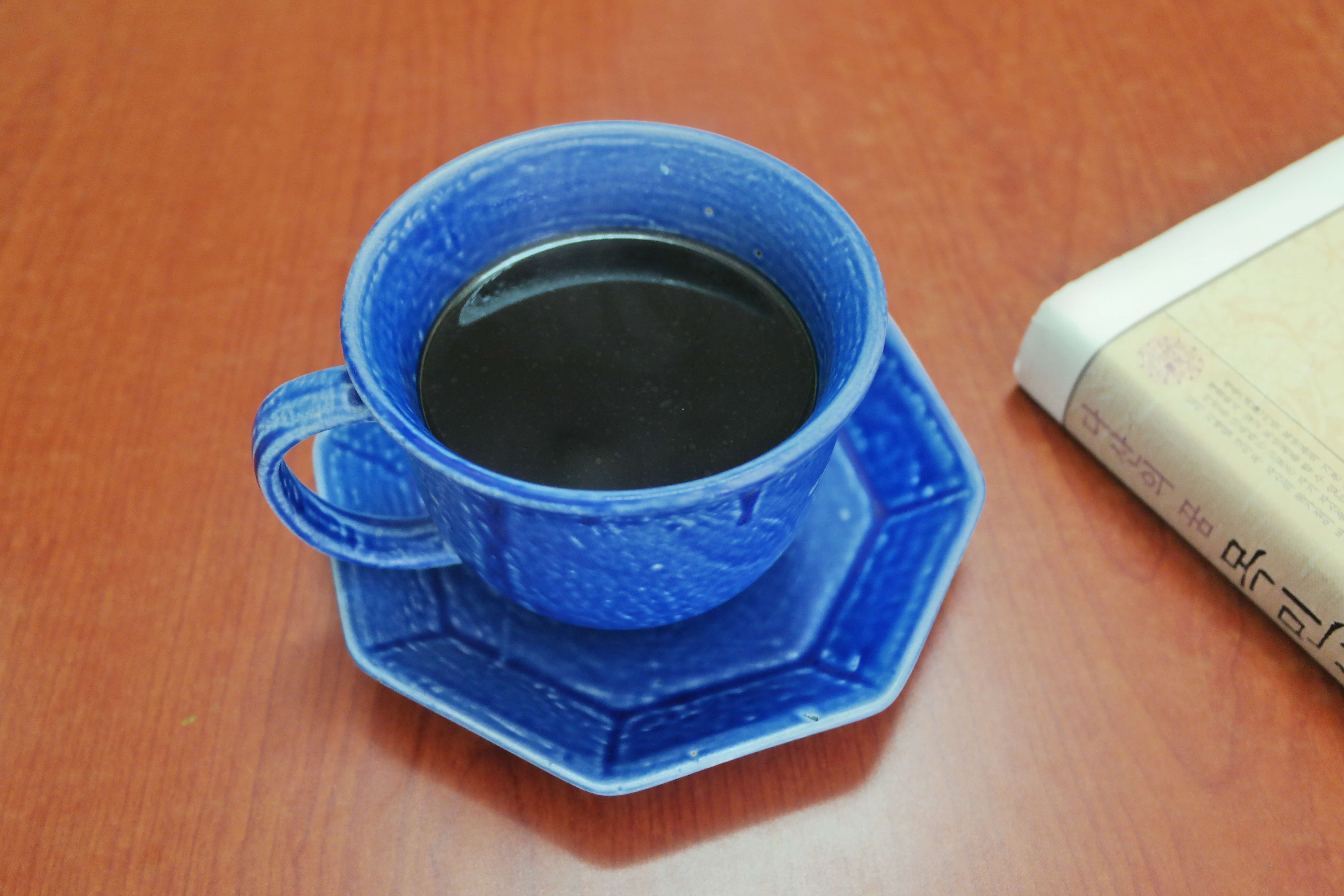 blue ceramic teacup