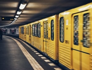 time laps photography of yellow train thumbnail