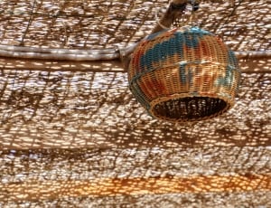 brown blue and red wicker round basket] thumbnail