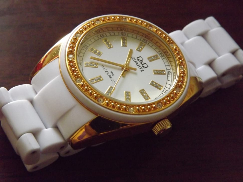 white strap and gold round analog watch preview