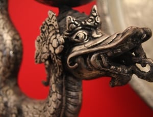 gray metal dragon figurine thumbnail