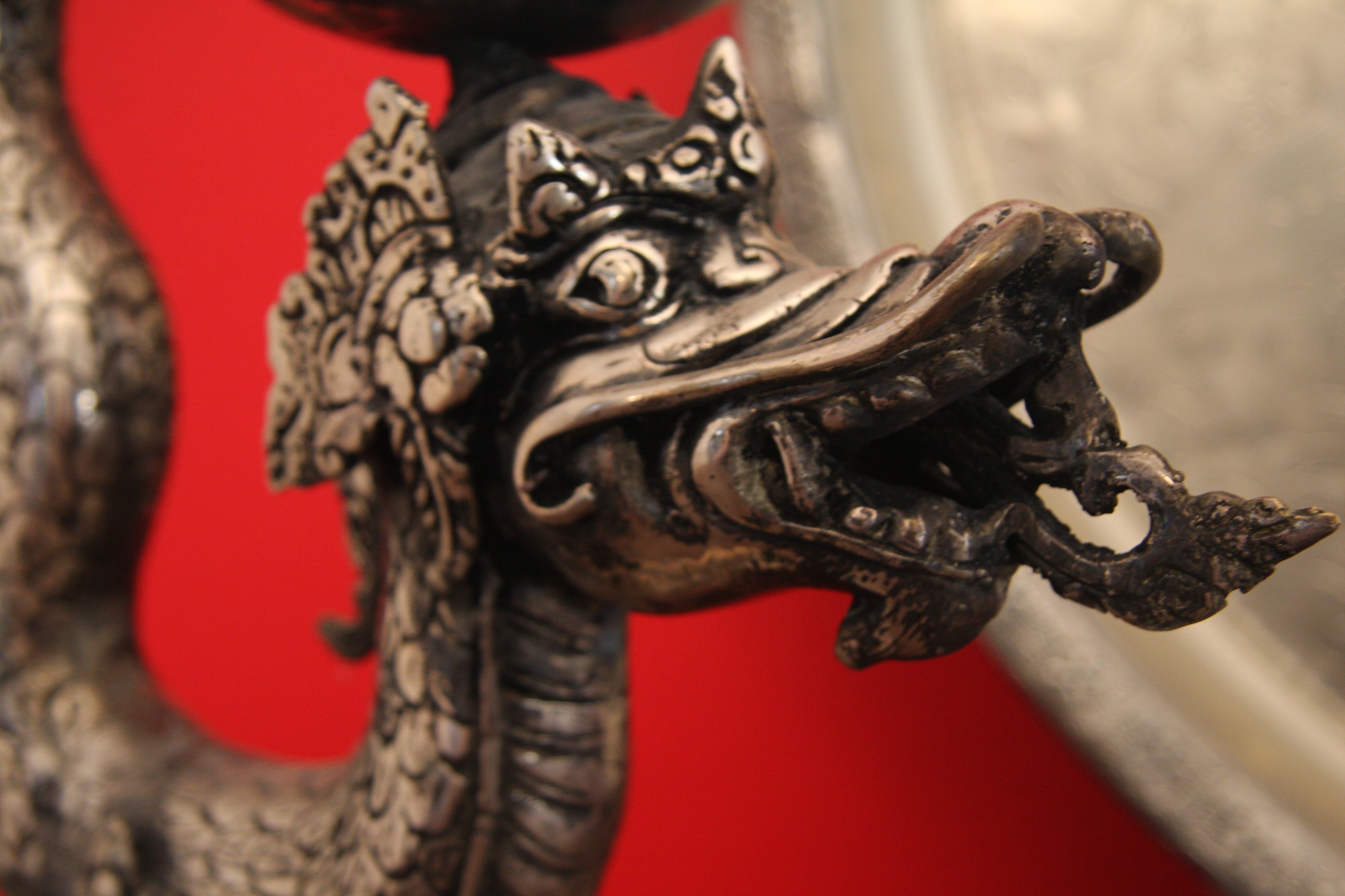 gray metal dragon figurine