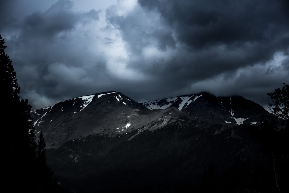 white and gray mountain under cloudy sky during nighttime preview