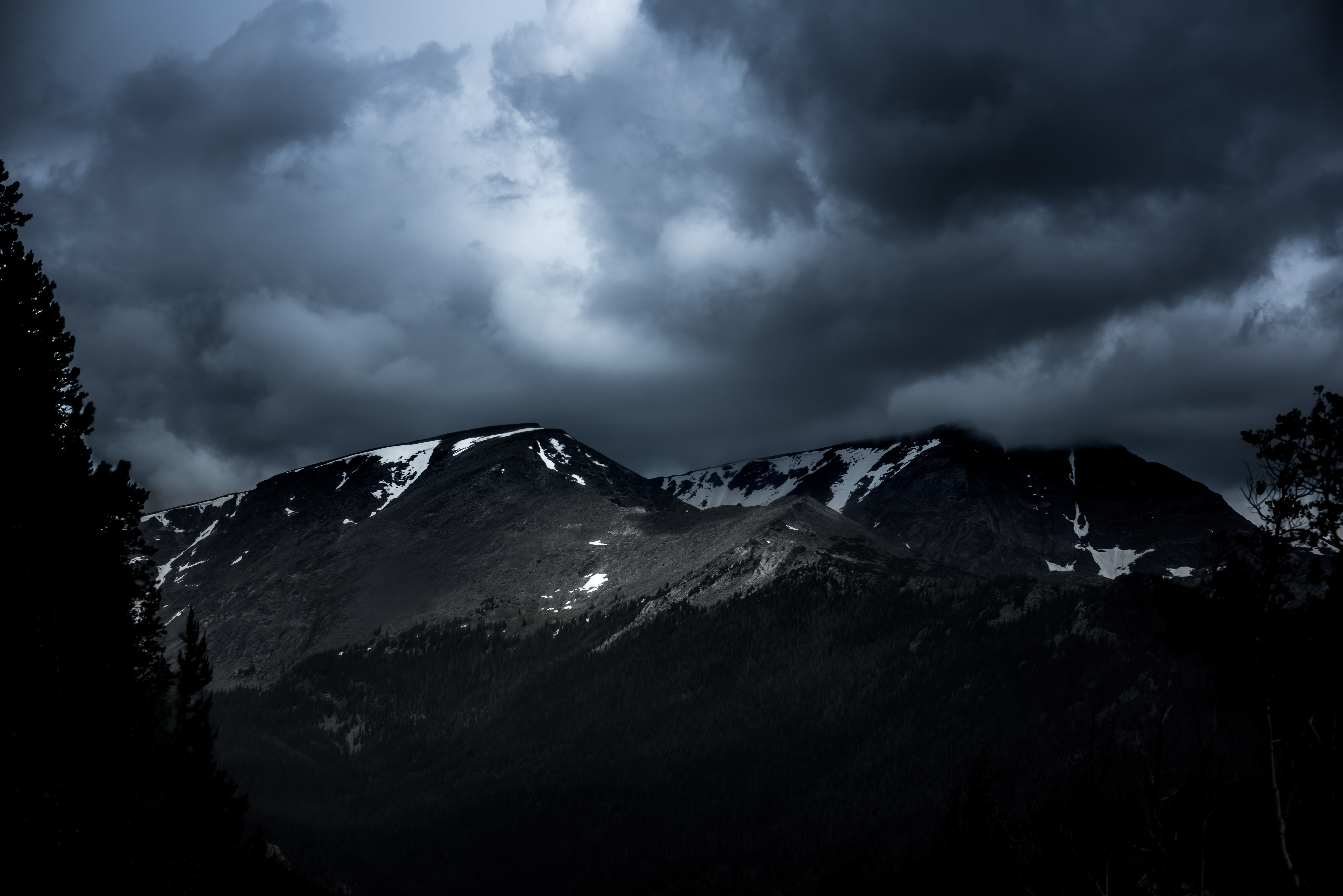 white and gray mountain under cloudy sky during nighttime