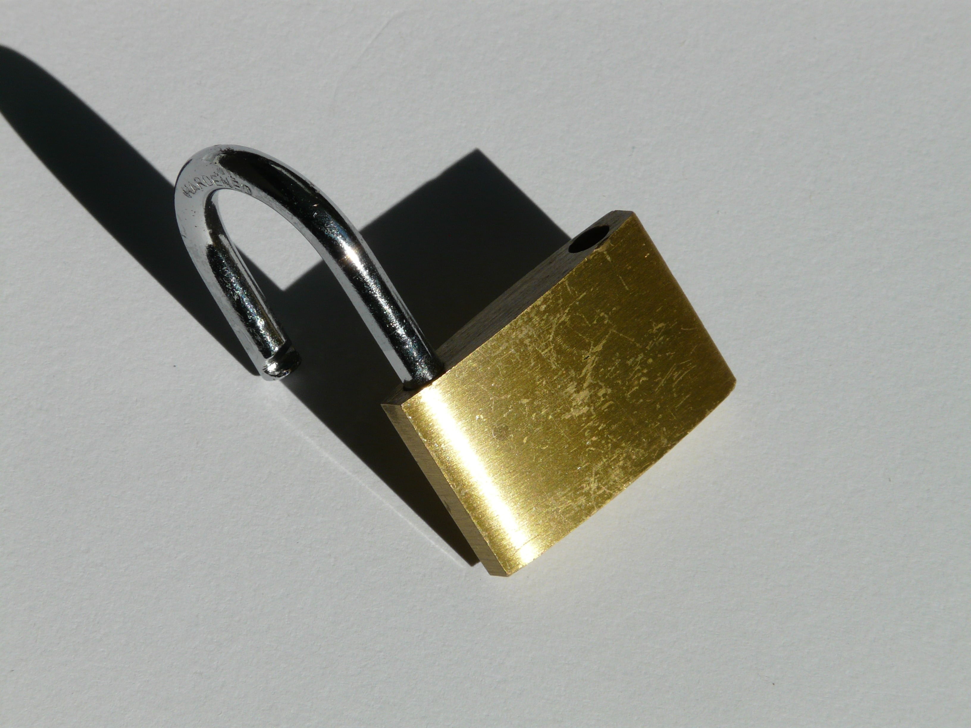 brass and silver padlock
