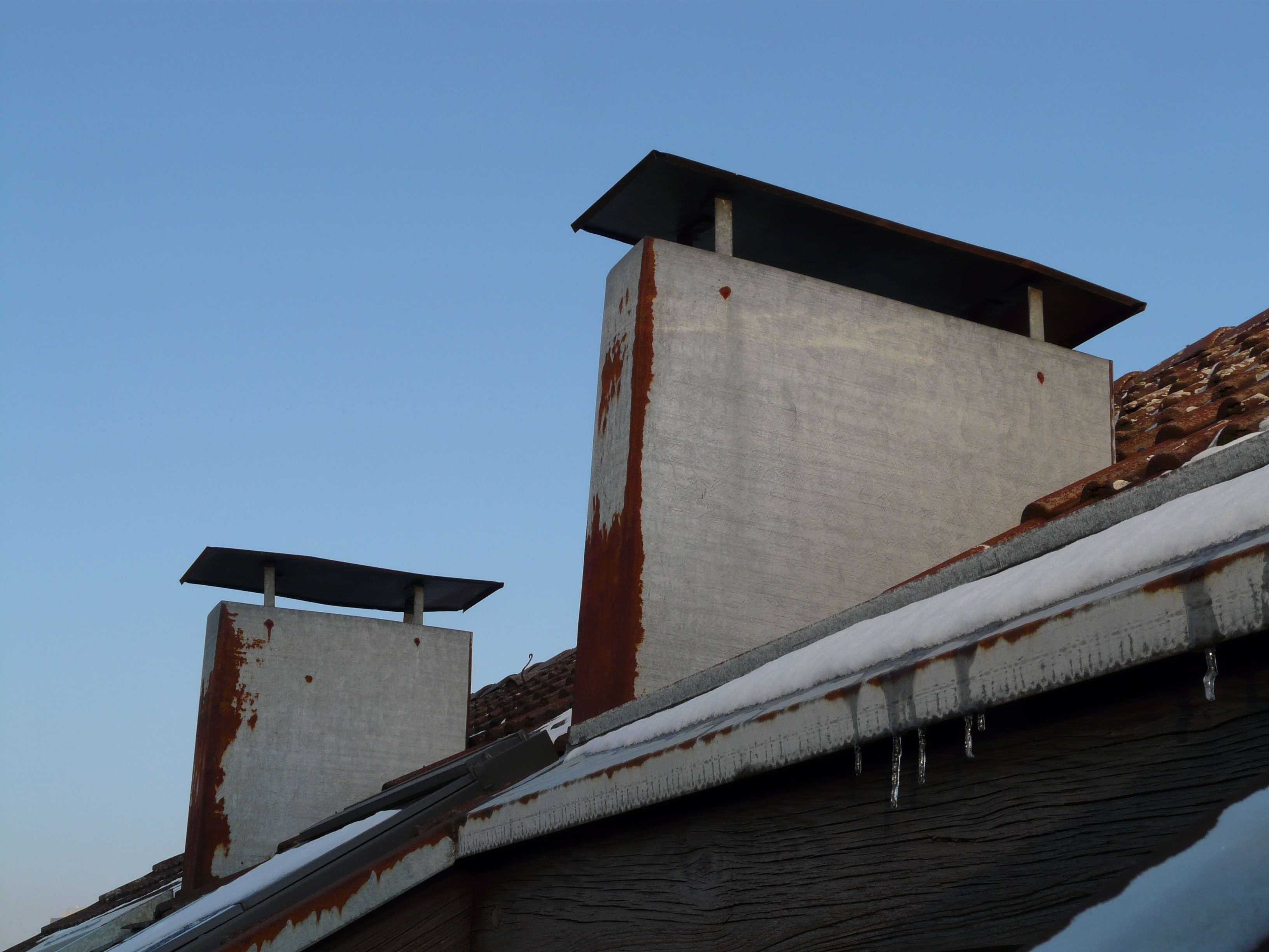 white concrete building roof vents