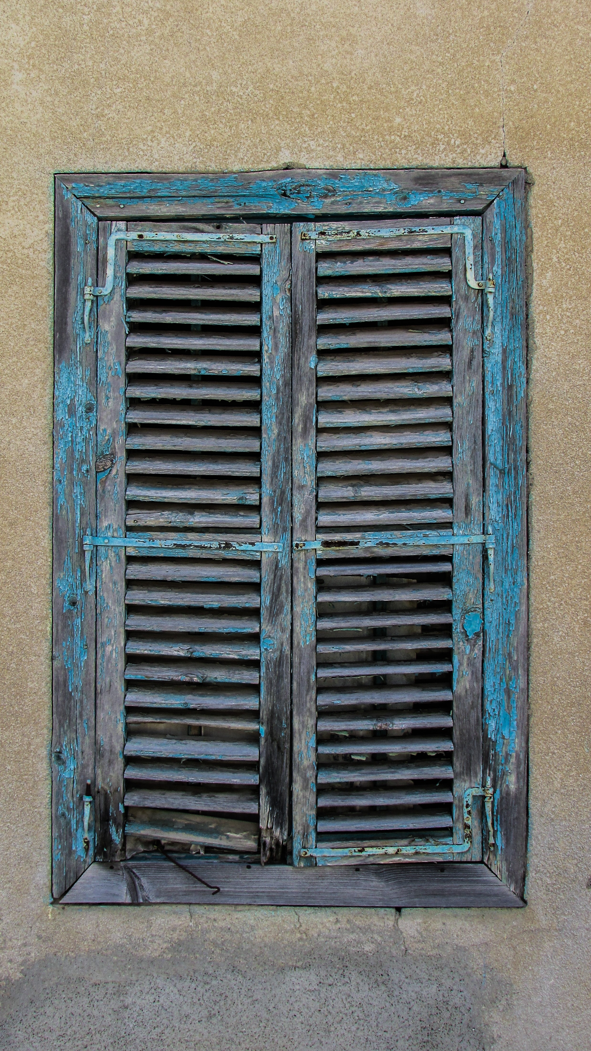 blue and grey wooden louvered window panel