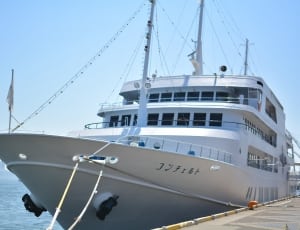 white cruise ship on ocean during daytime thumbnail