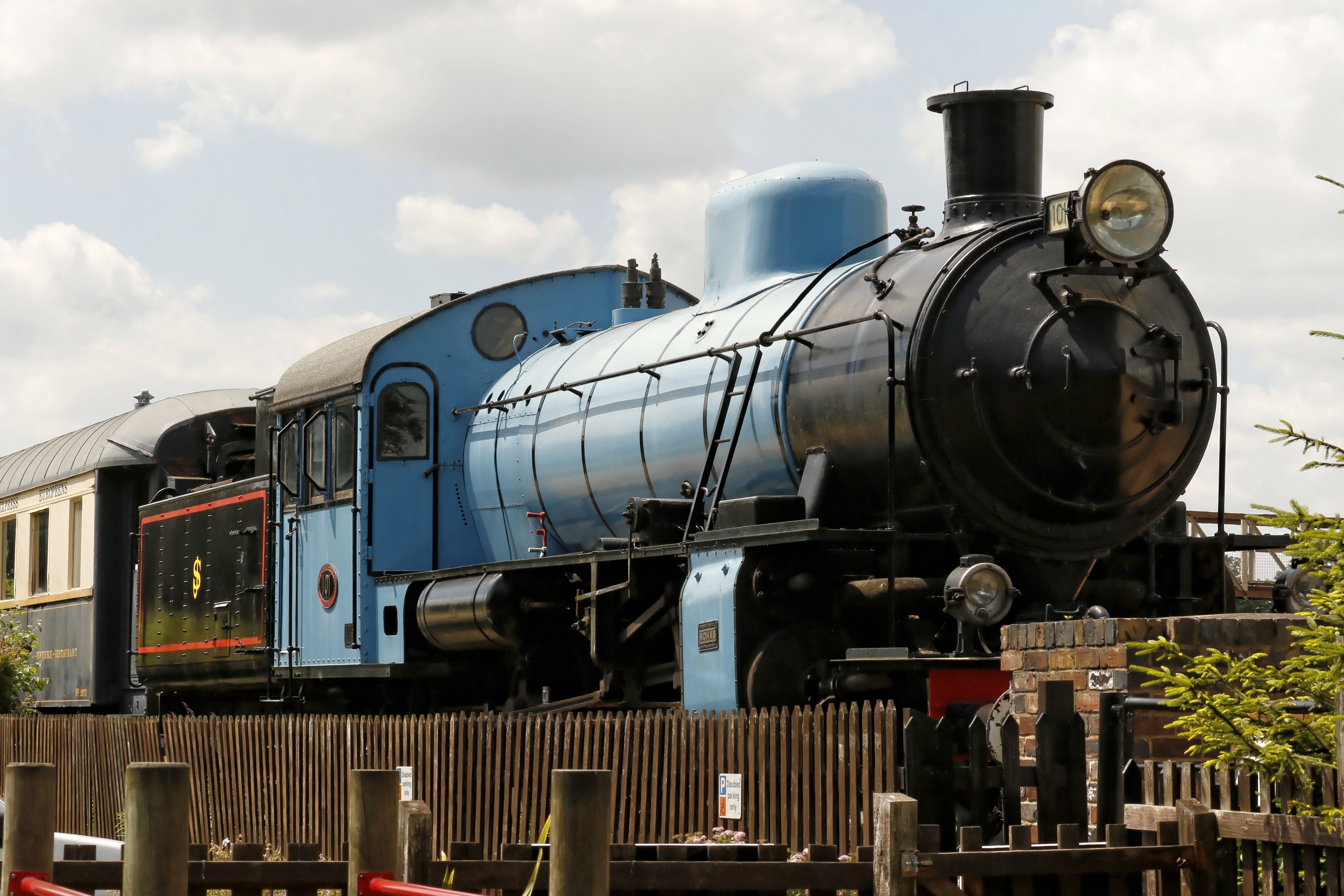 close up photo of blue and black parked train
