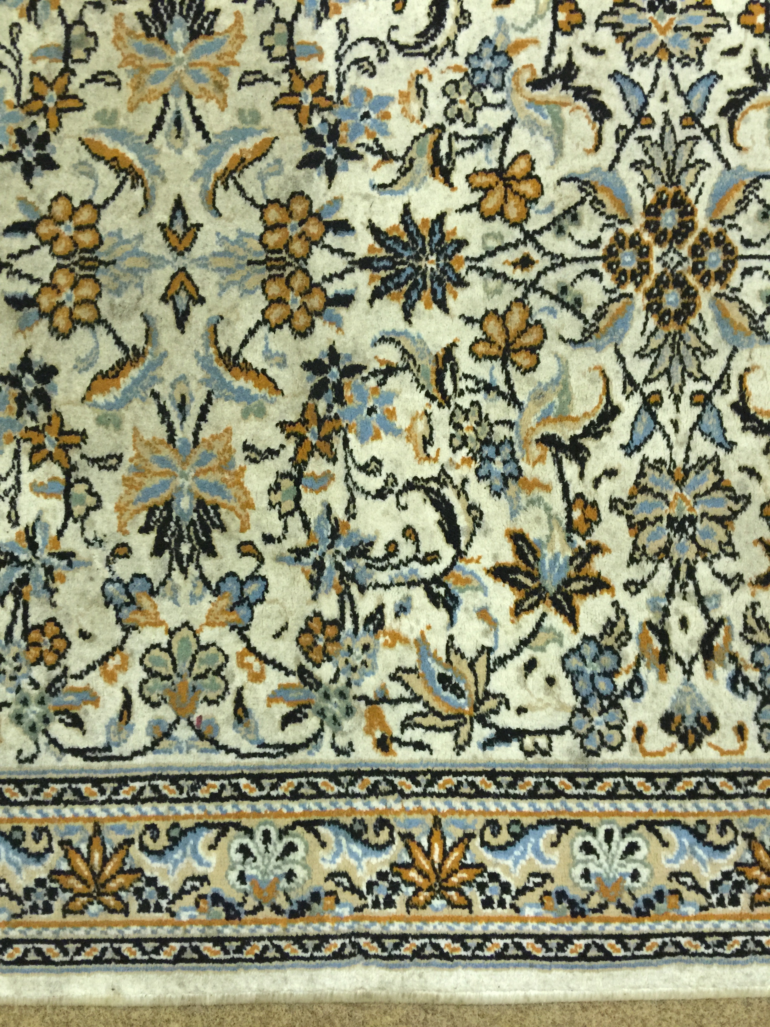 white brown and cyan floral area rug
