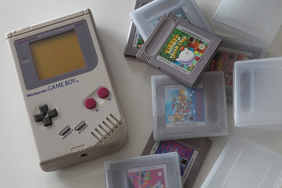 white nintendo game boy with game cartridges preview