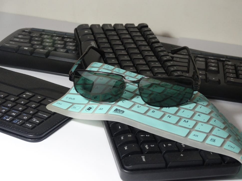 black sunglasses and 3 keyboards preview
