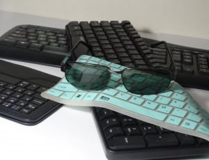 black sunglasses and 3 keyboards thumbnail