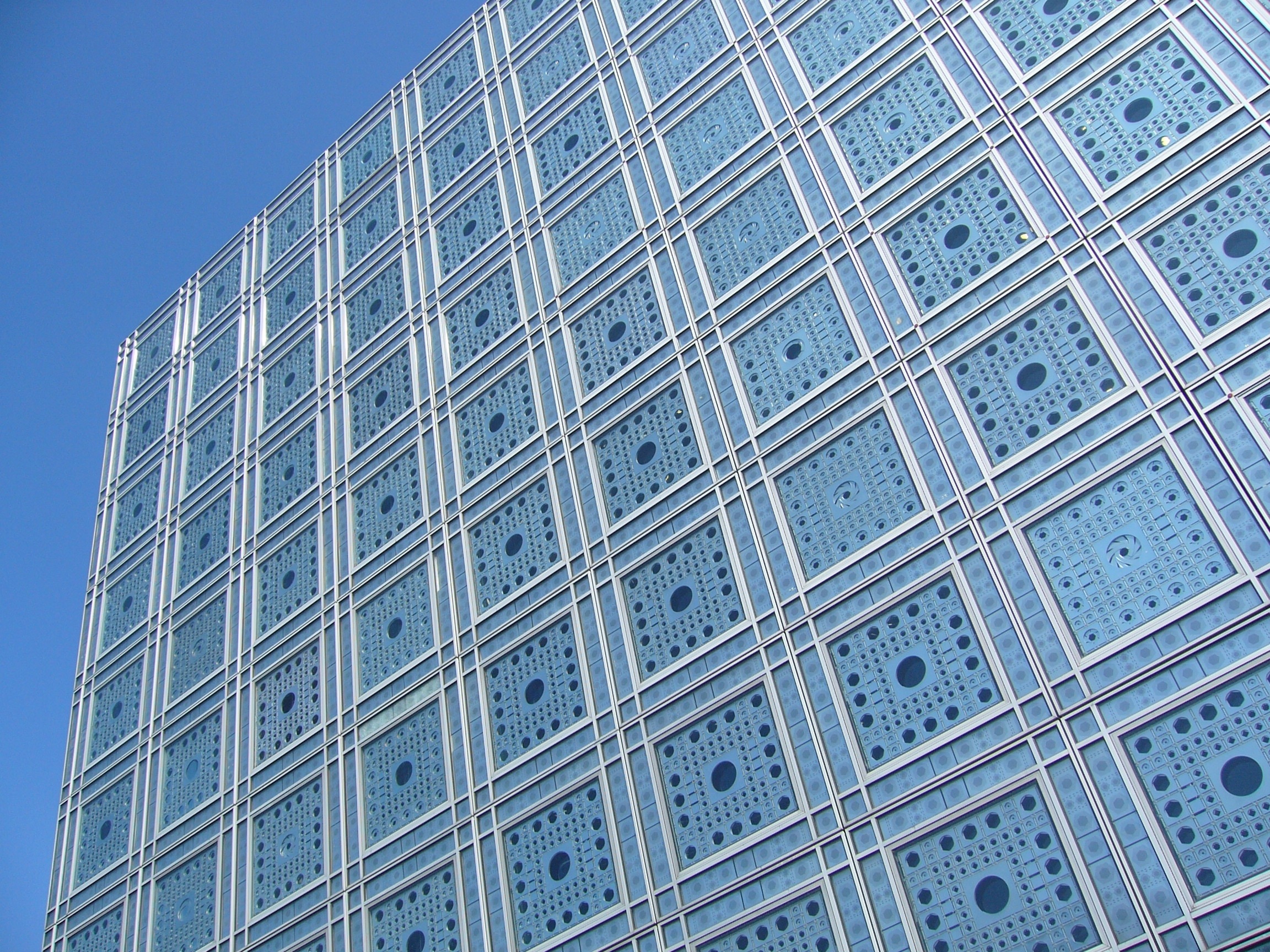 silver and blue high rise building