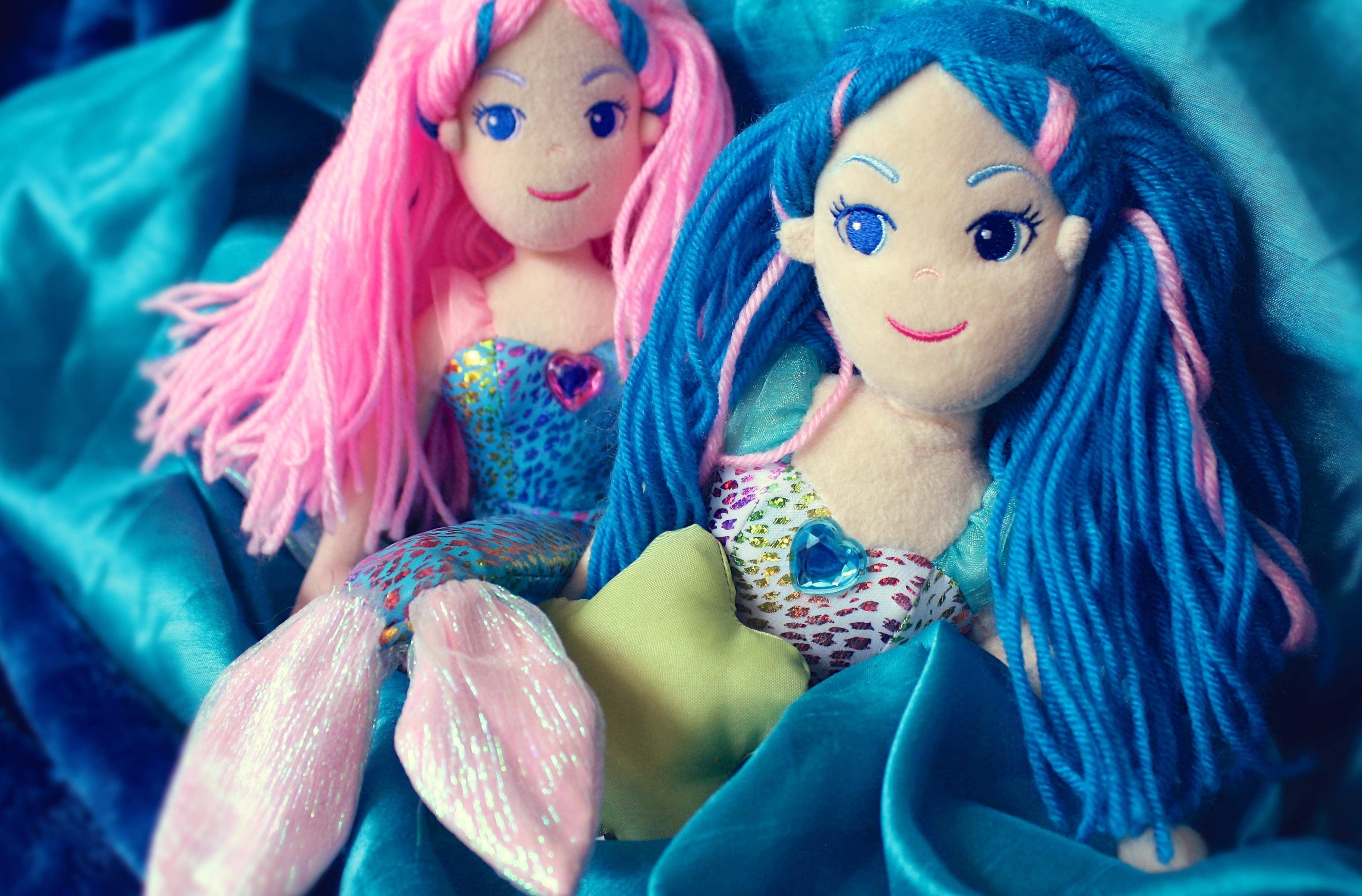 two mermaid plush toys