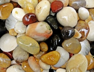 yellow black white brown and red pebbles thumbnail