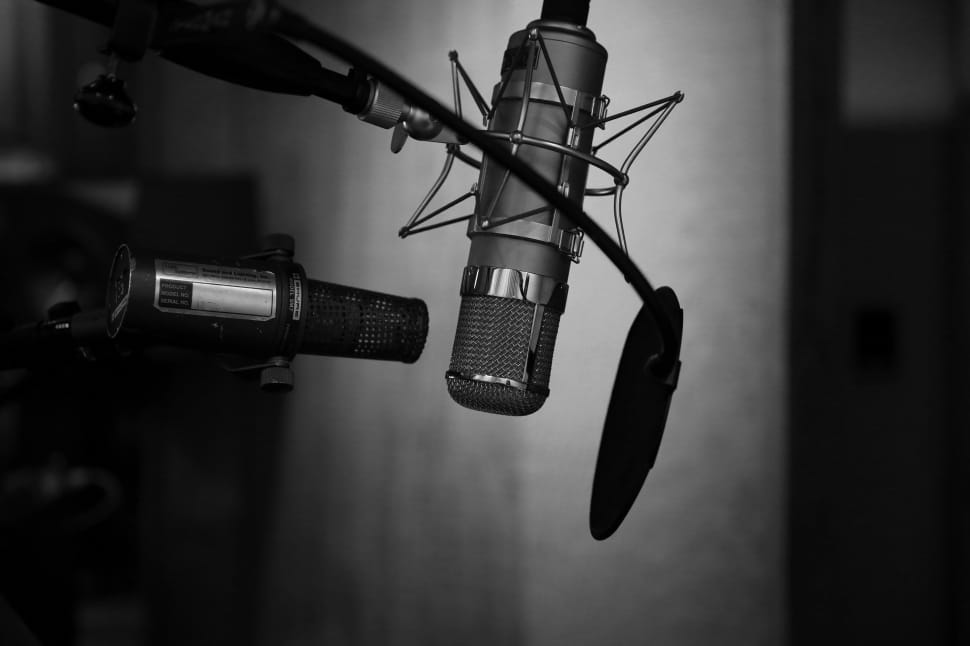 black microphone in gray scale photography preview