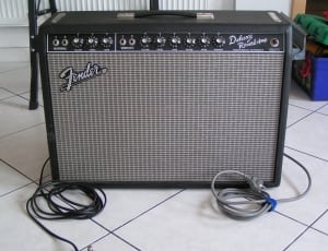 black fender guitar amplifier; white floor tiles thumbnail