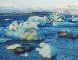 white iceberg on blue body of water thumbnail