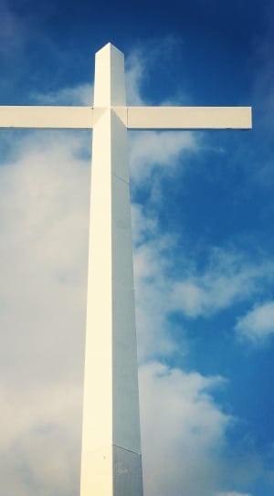 white gothic cross and blue sky thumbnail