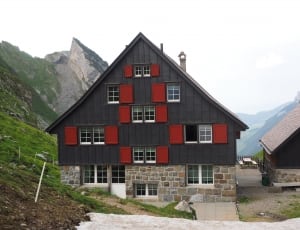 black and red wooden residential building thumbnail