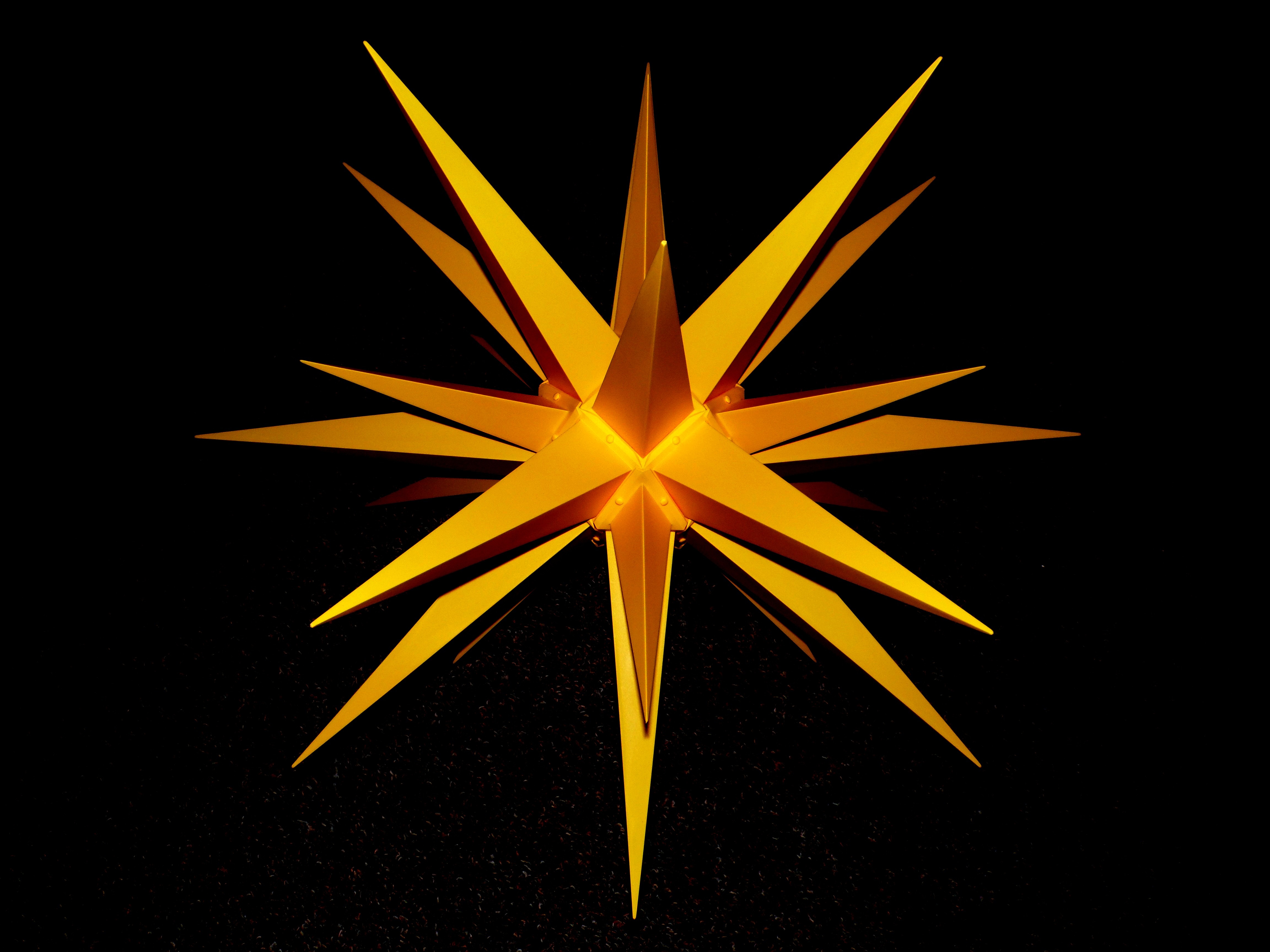 yellow spiky logo