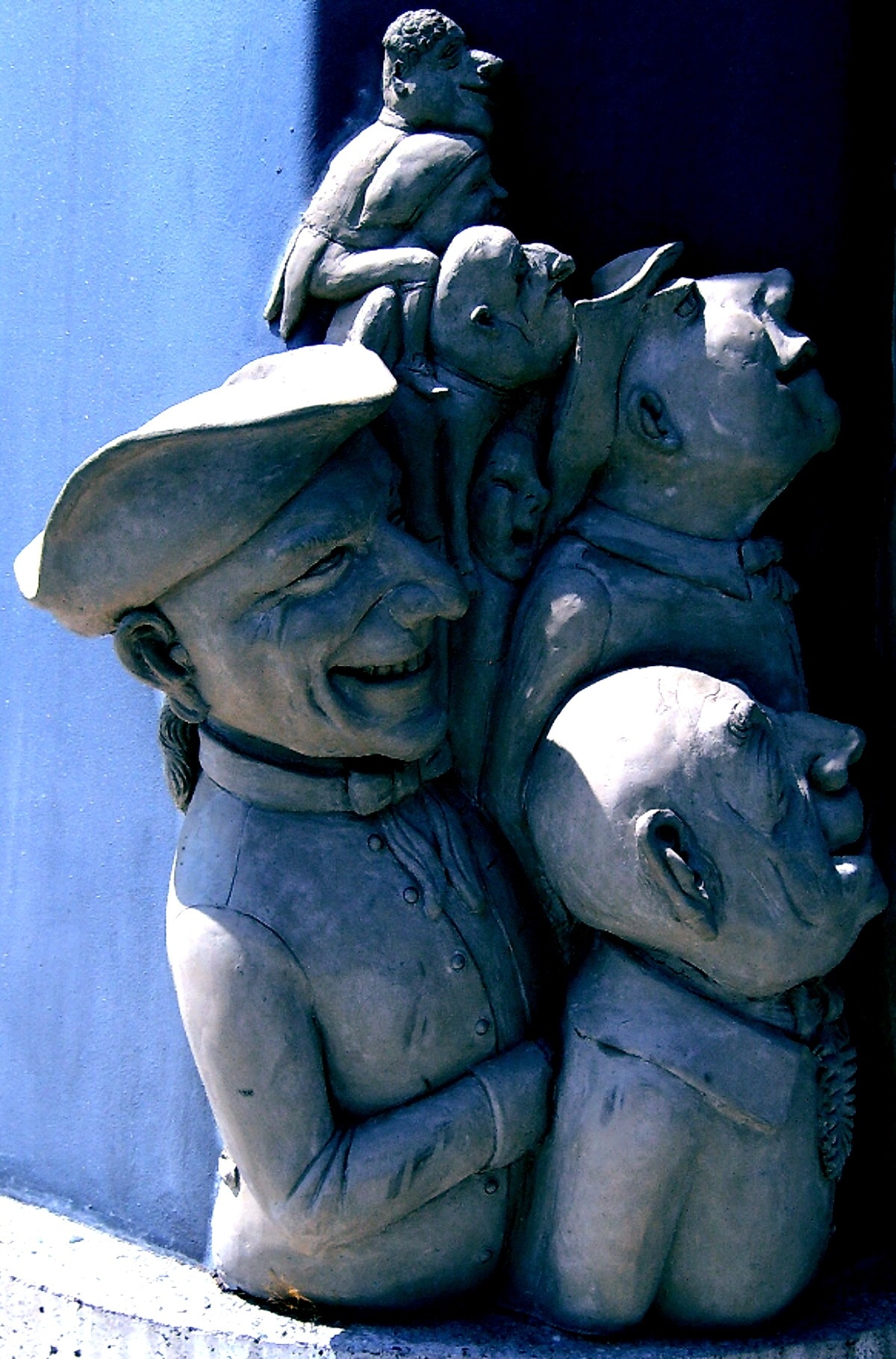 grey ceramic group of people statue
