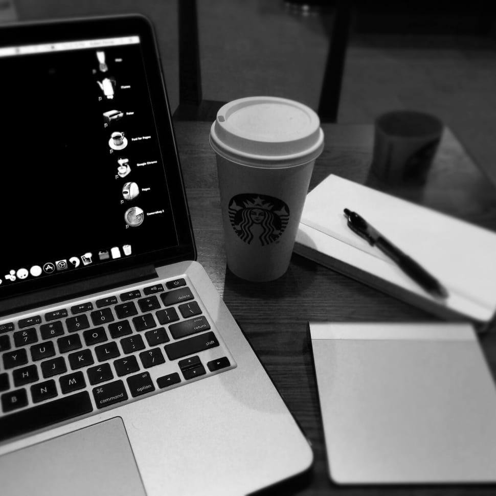macbook pro and starbucks disposable cup and retractable pen preview