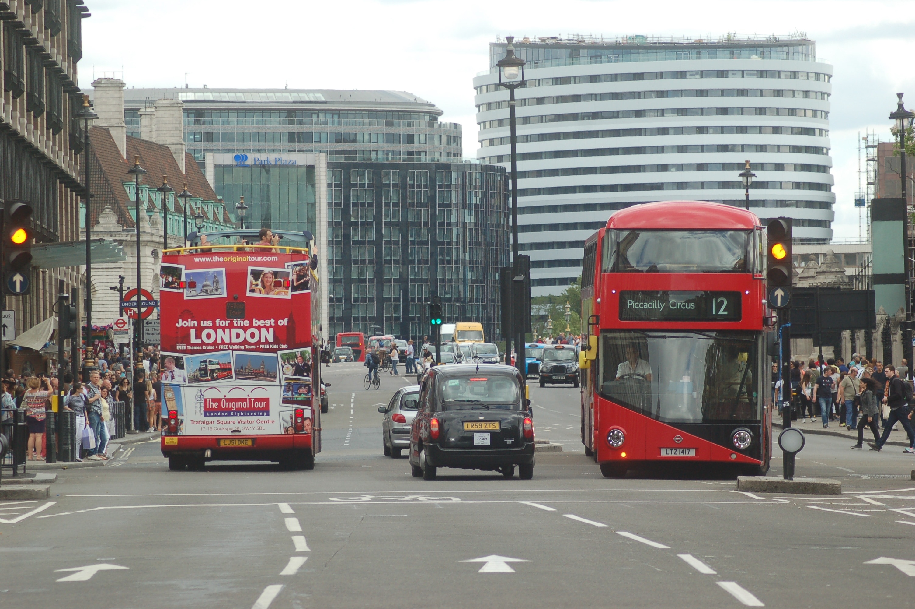 2 red bus and 1 black car