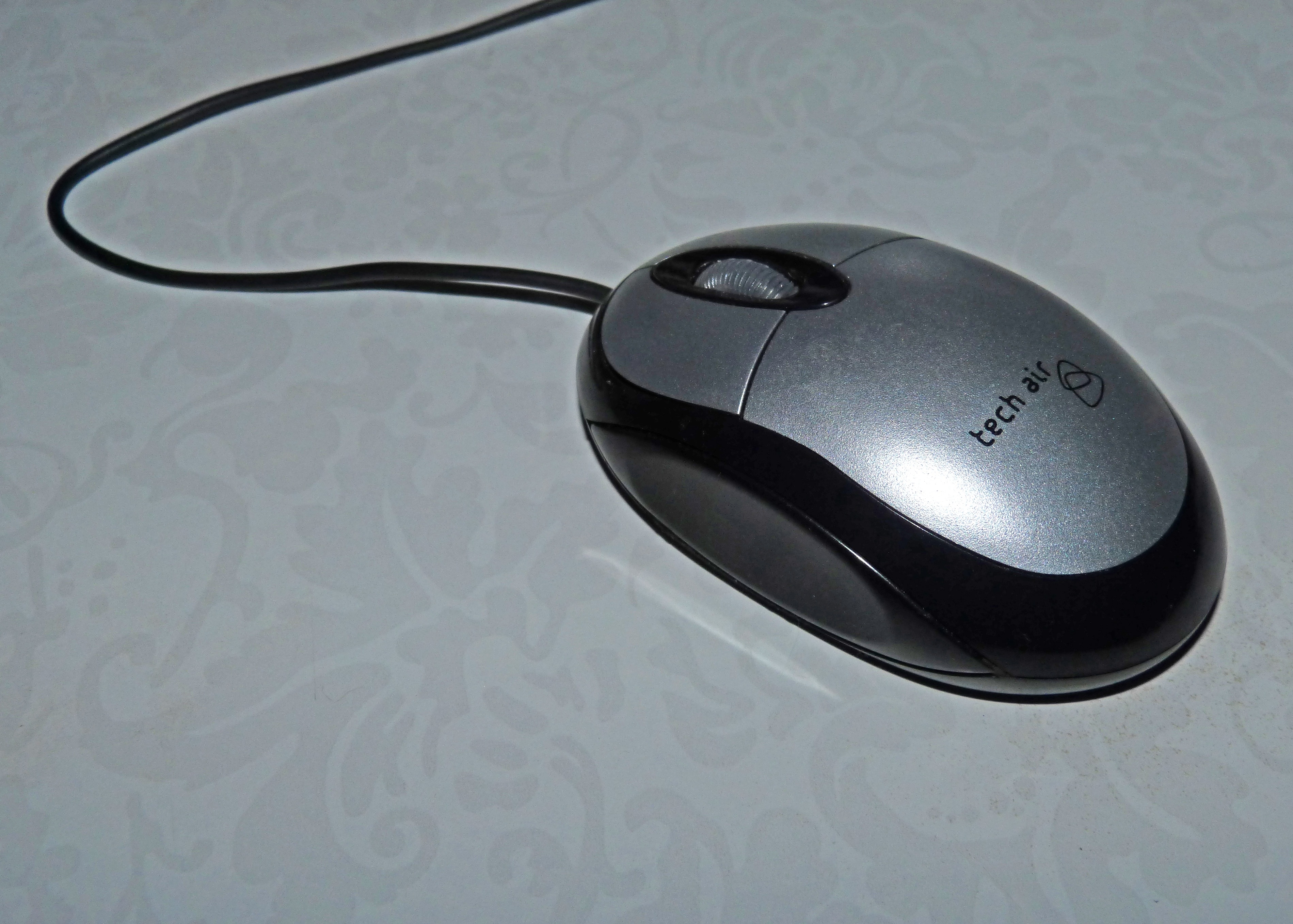 black and gray tech corded mouse