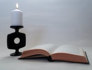 book page and pillar candle thumbnail