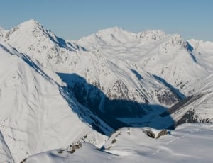 photography of mountains covered by snow at daytime thumbnail