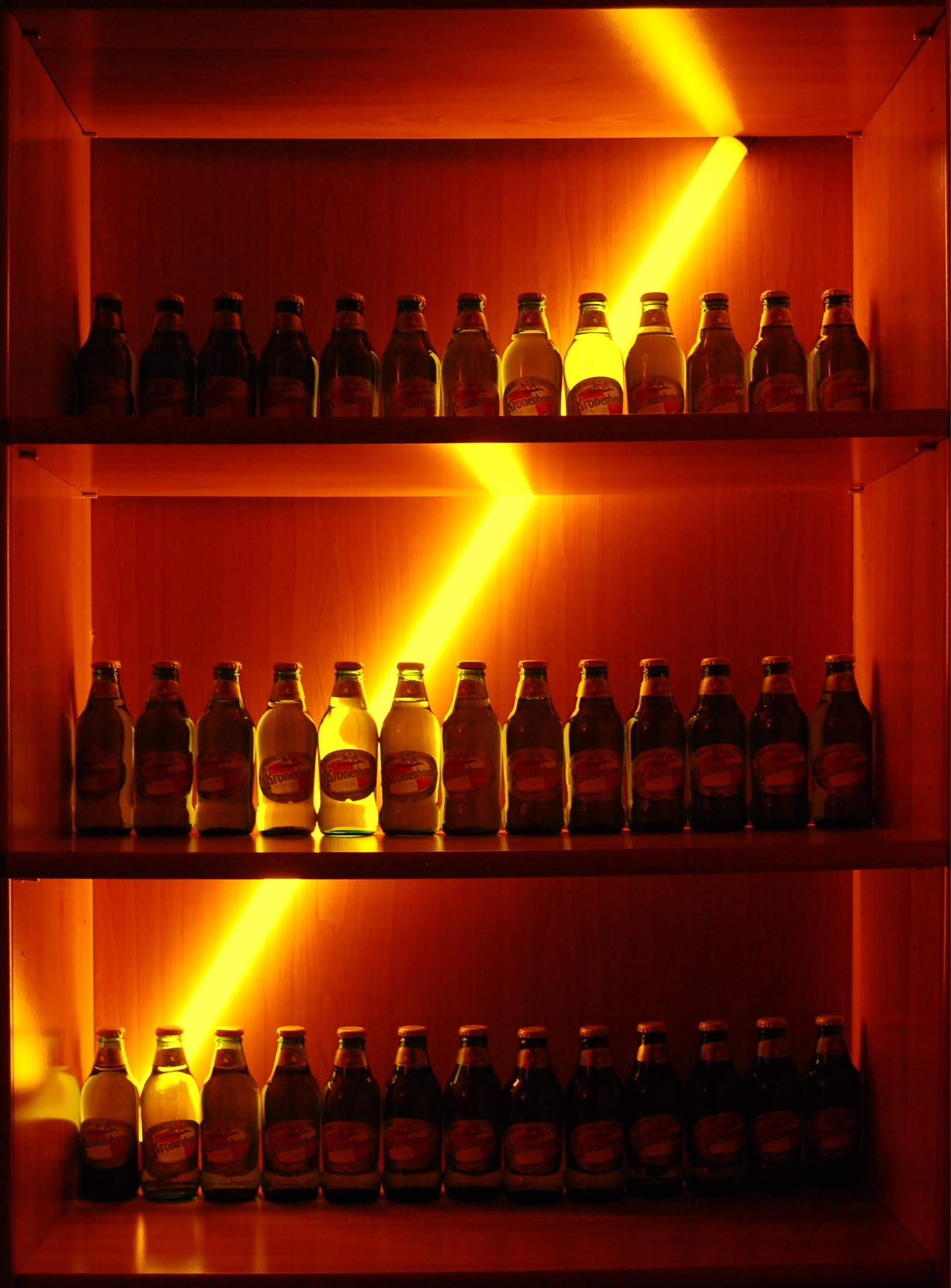 bottle lot on brown shelf