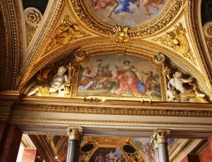 brass and white ceiling with a group of people painting thumbnail