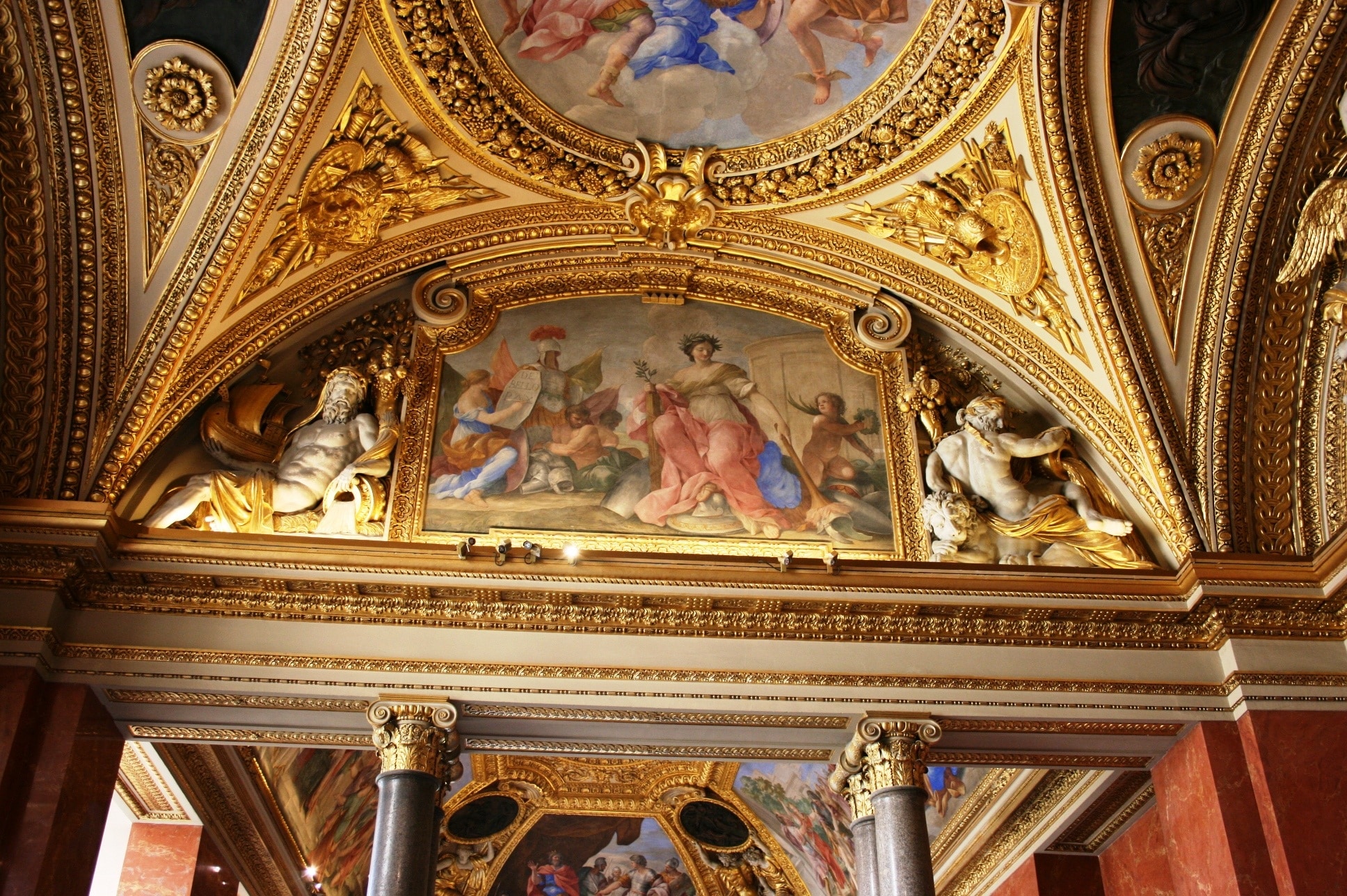 brass and white ceiling with a group of people painting
