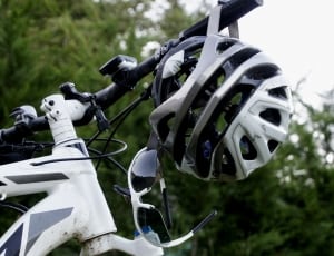 black and white bicycle with helmet thumbnail
