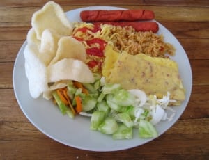 cutted vegetables, fried rice, hotdogs, omelette egg and fried crackers thumbnail