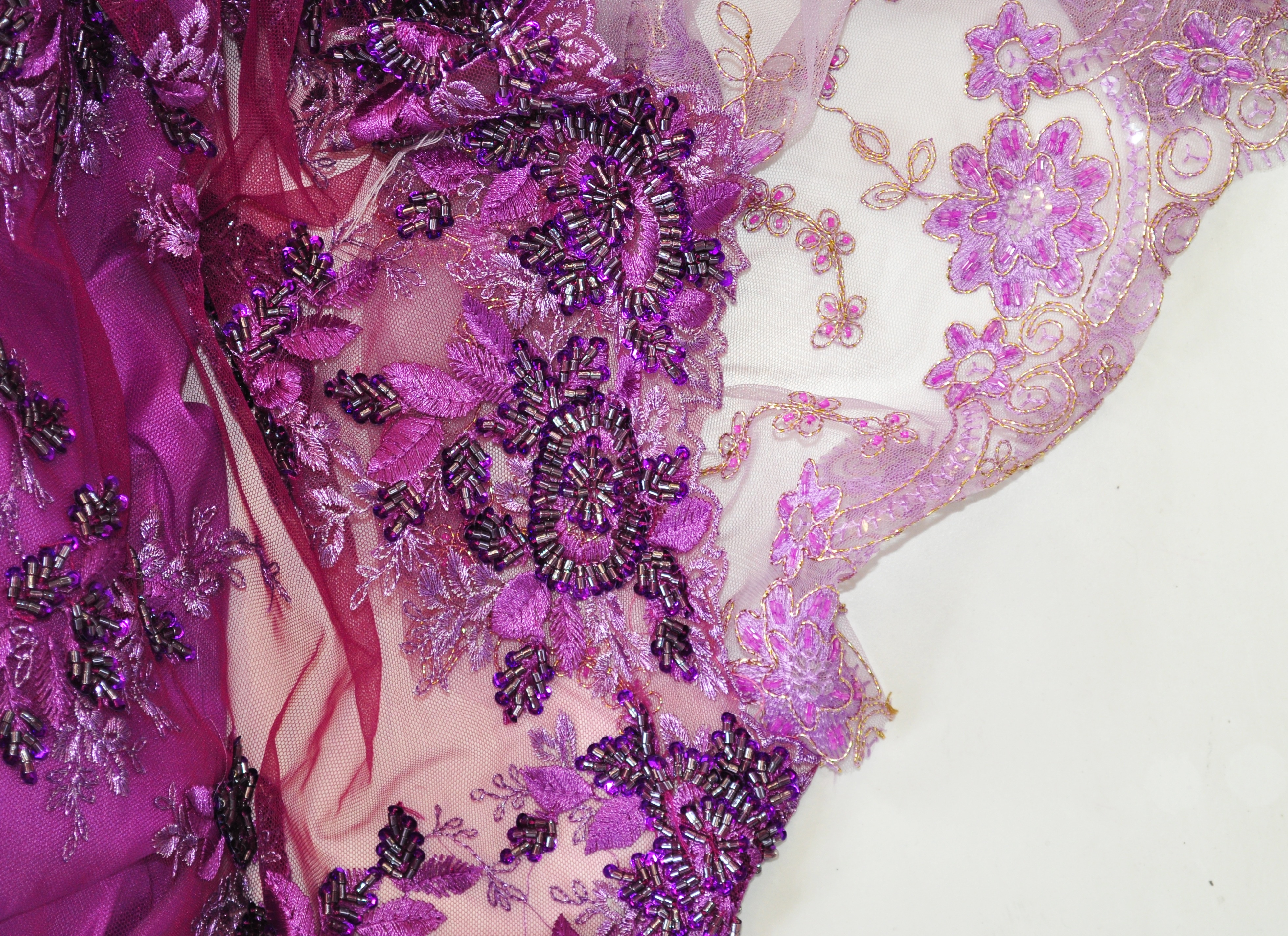 beige and purple floral satin textile