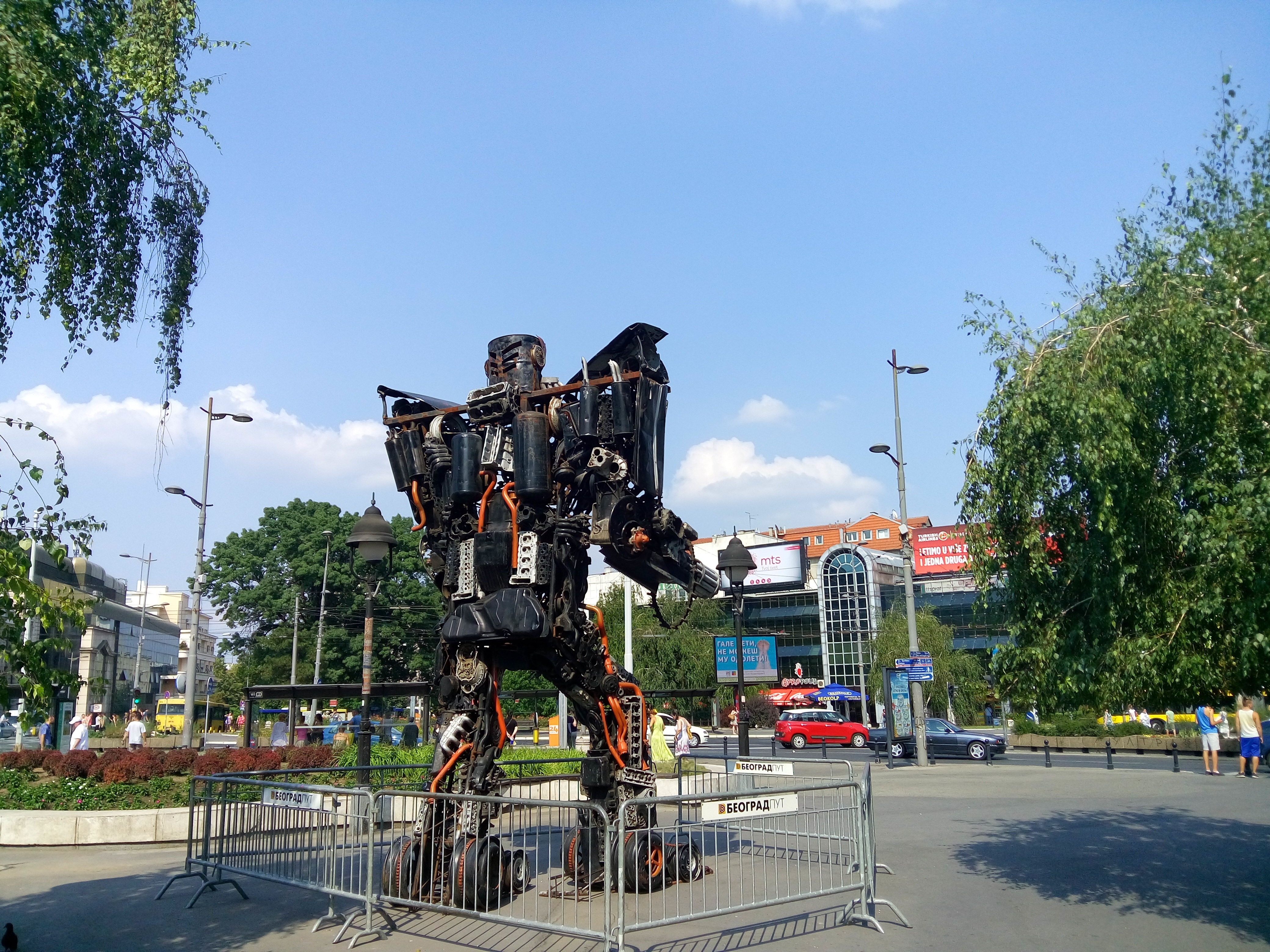 orange and black steel robot in park