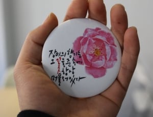 white and pink floral printed kanje text round pinback thumbnail