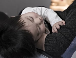 baby's sleeping on person forearms thumbnail
