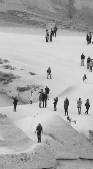 greyscale photo of people on snow field thumbnail