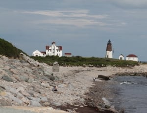 white and red house and white and brown lighthouse thumbnail