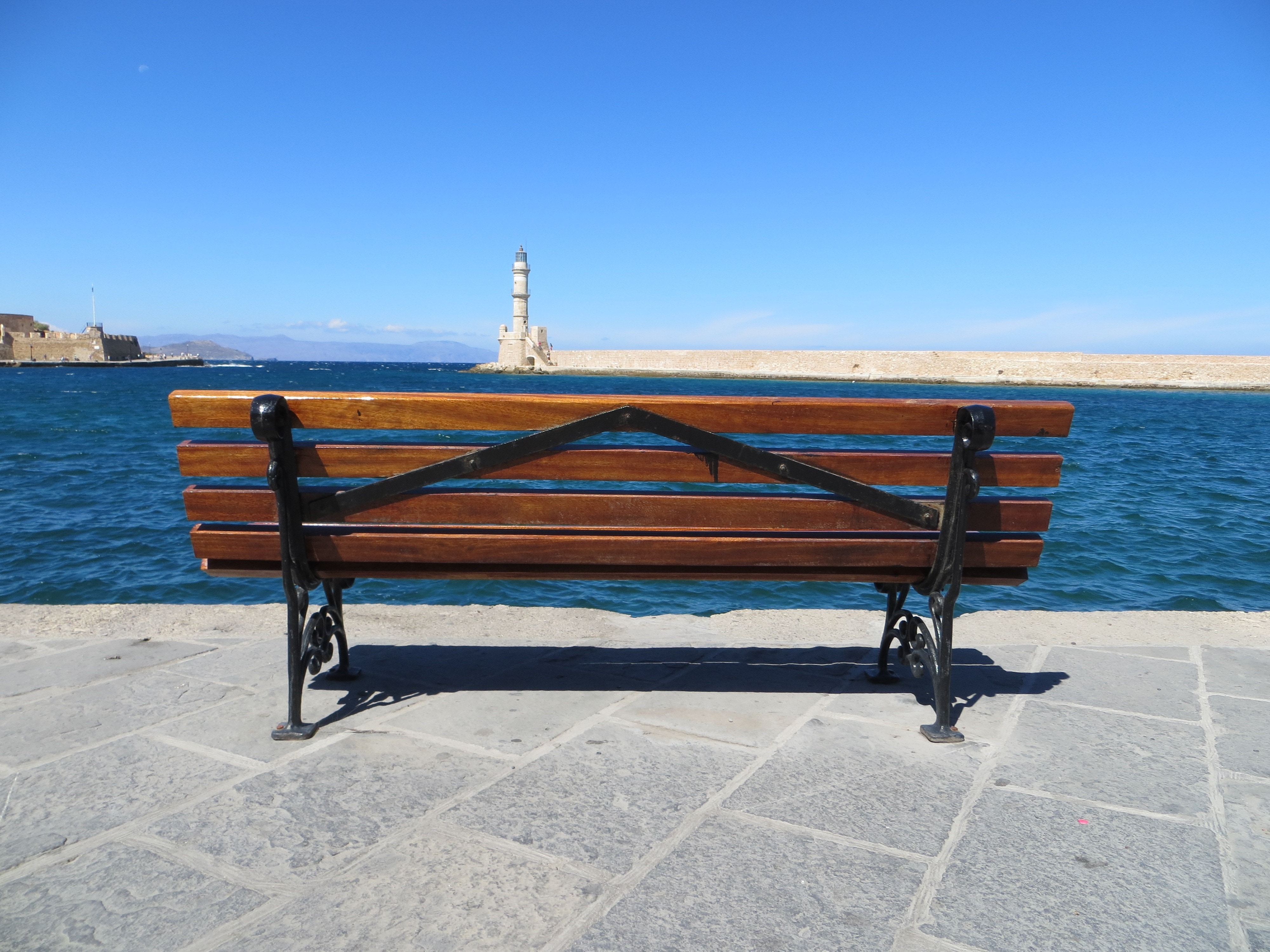 brown wooden bench with black metal frame