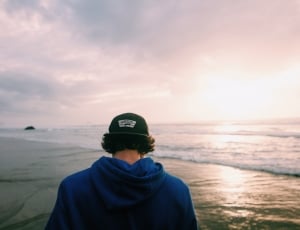 man in blue hoodie on seaside thumbnail